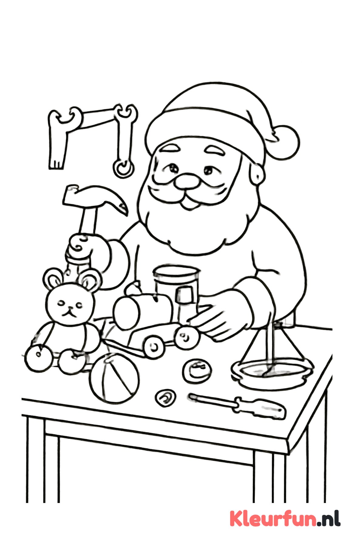 Kerstman aan werktafel met speelgoed