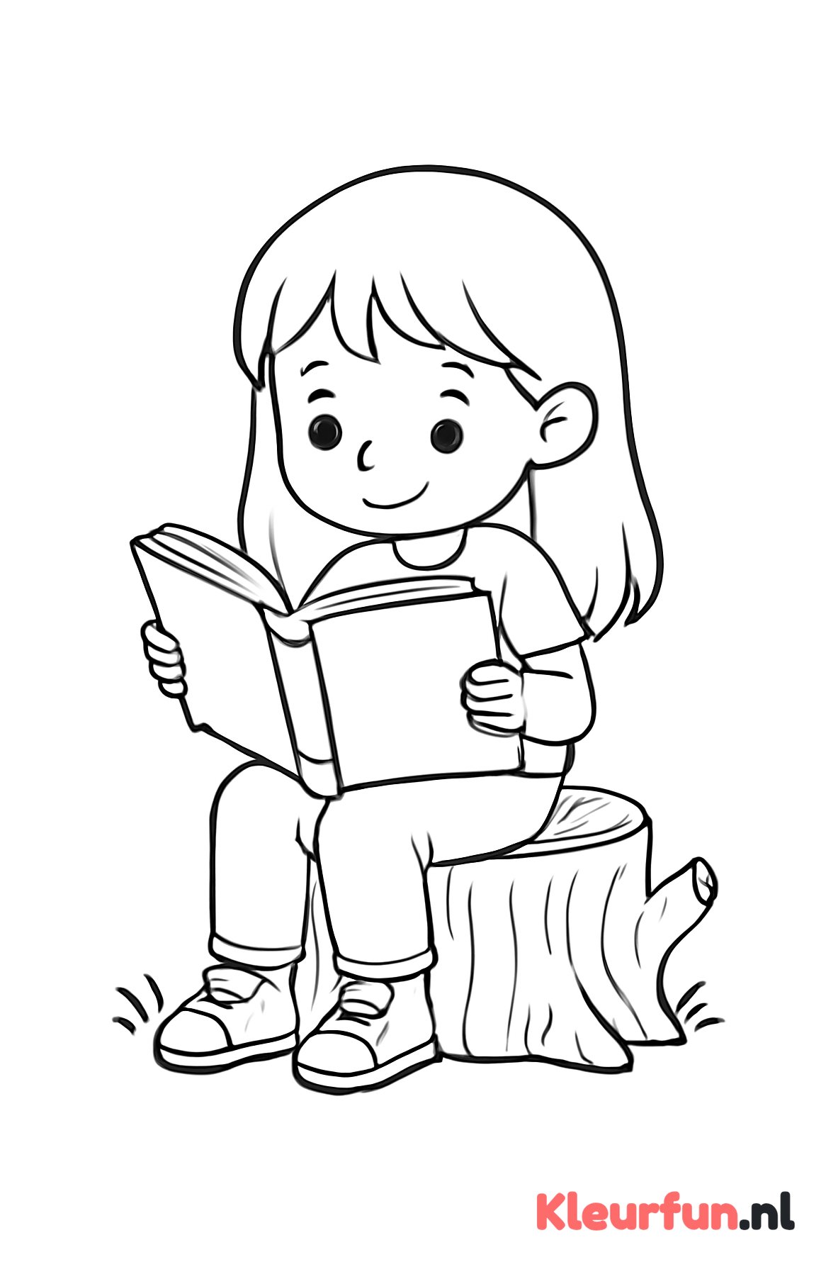 Meisje leest een boek onder een boom