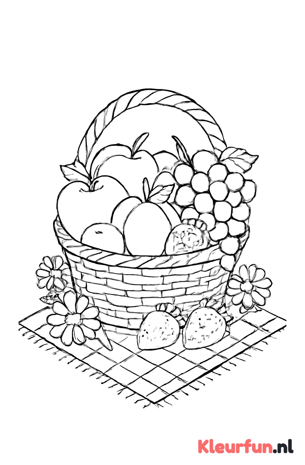 Fruitmand op picknickkleed
